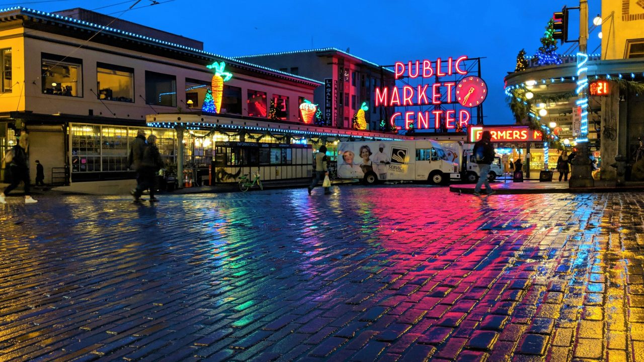nighttime view of pike place market at night after a rain