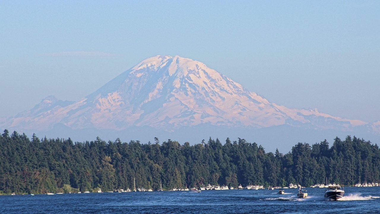 landscape view of lake with mount rainier in the background