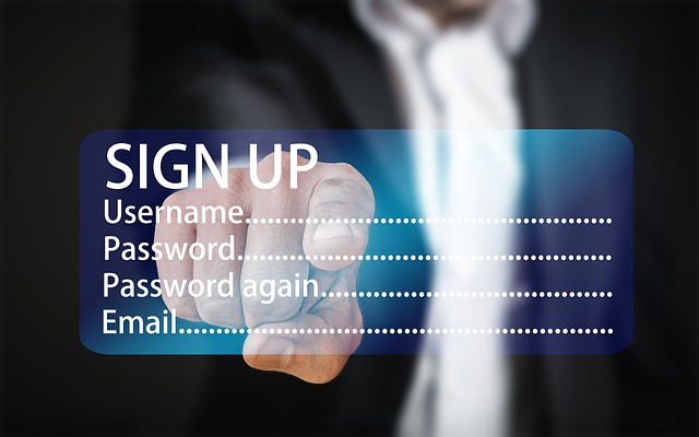 close up on finger clicking on sign up screen