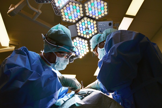 doctors performing a surgery with an hexagon light overhead