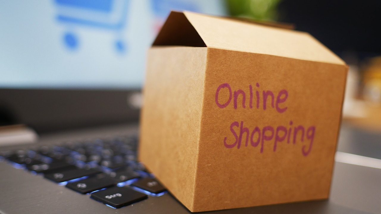 close up of an open laptop with a small box that reads online shopping