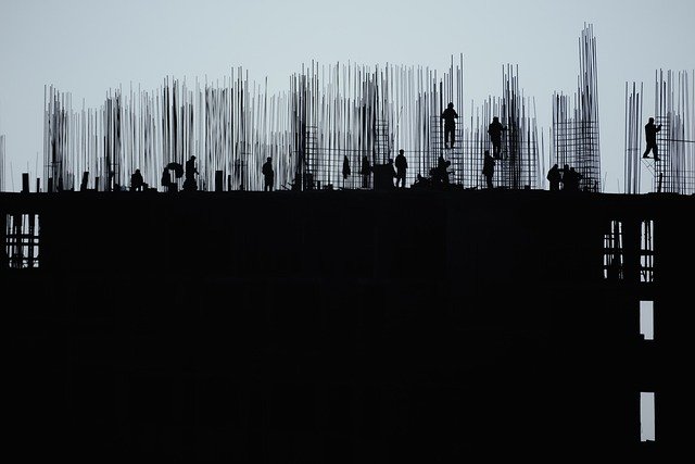 silhouette of construction workers